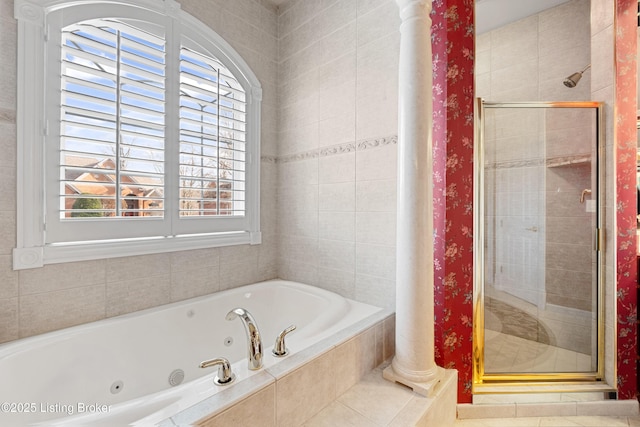 bathroom with a wealth of natural light and shower with separate bathtub