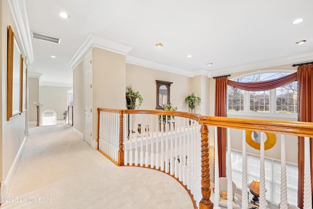 hallway with light carpet and ornamental molding