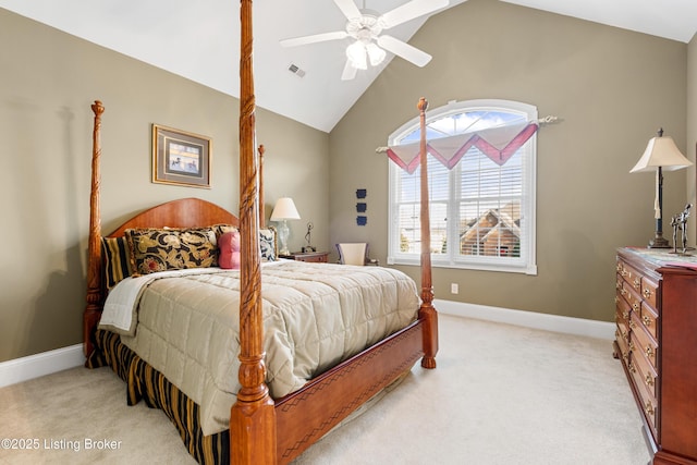 bedroom with ceiling fan, lofted ceiling, and light carpet