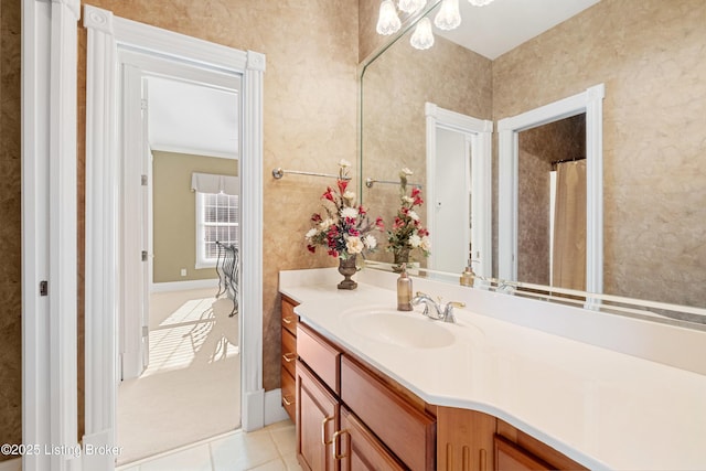 bathroom with vanity, tile patterned floors, and crown molding