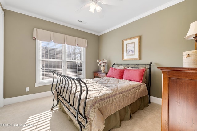 carpeted bedroom with ceiling fan and crown molding