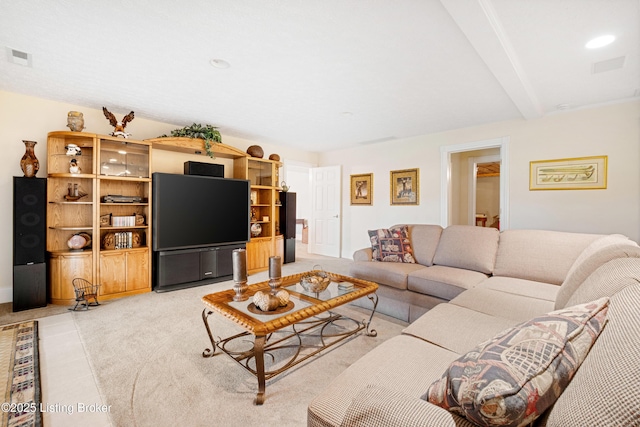 living room featuring beamed ceiling