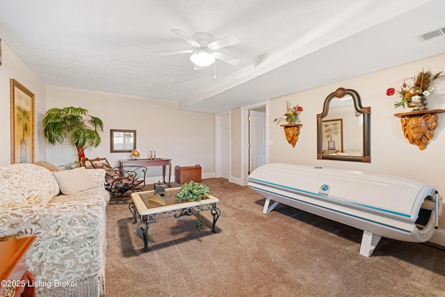 interior space with ceiling fan and a textured ceiling