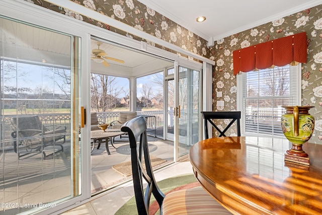 interior space featuring ceiling fan and ornamental molding