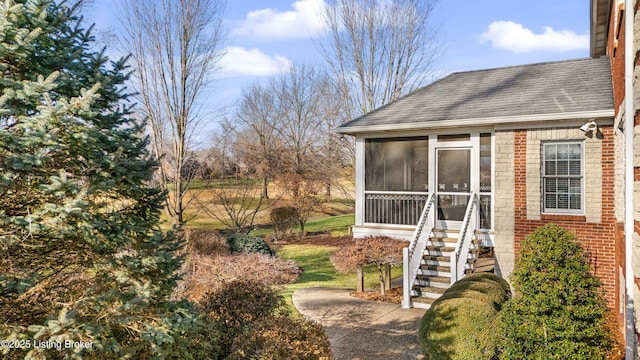 view of yard with a sunroom