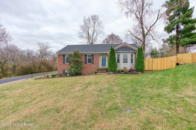 ranch-style house with a front lawn