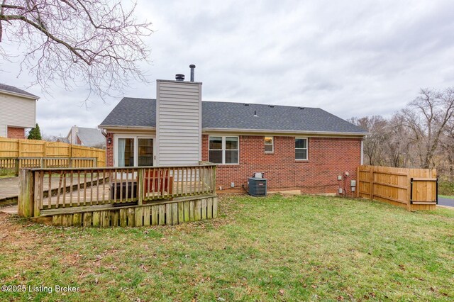 back of house with a lawn, central AC unit, and a wooden deck