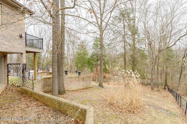 view of yard featuring a balcony