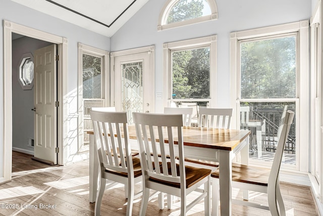 sunroom / solarium featuring vaulted ceiling