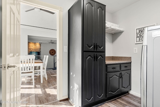 kitchen featuring dark hardwood / wood-style floors and refrigerator