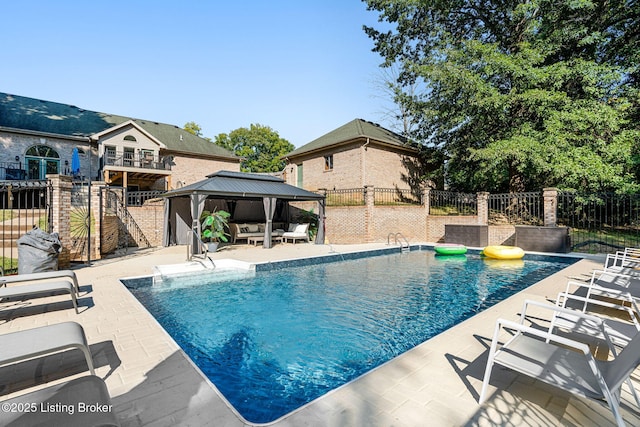 view of pool with a gazebo and a patio area