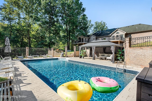 view of pool with a gazebo and a patio area