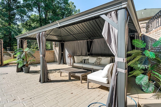 view of patio featuring a gazebo and an outdoor living space