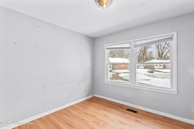 spare room featuring light hardwood / wood-style flooring