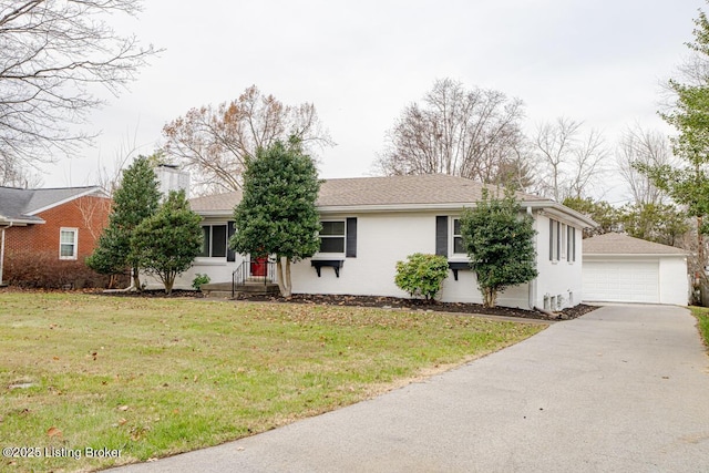 single story home featuring a front lawn, a garage, and an outdoor structure