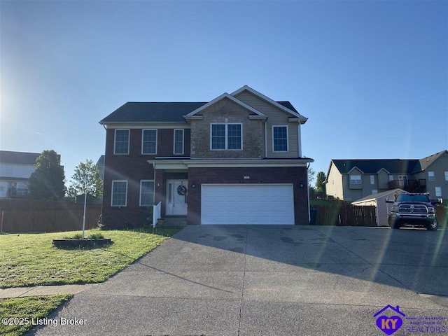 front of property featuring a garage and a front lawn