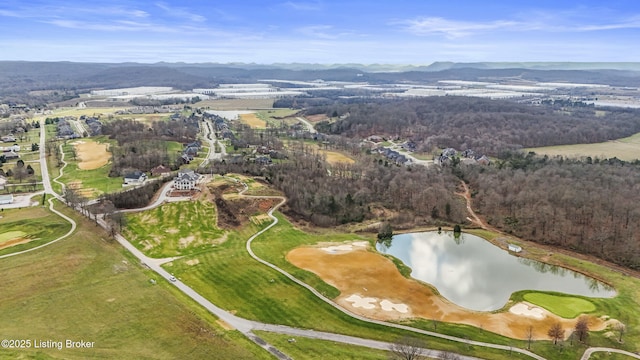 drone / aerial view featuring a water and mountain view