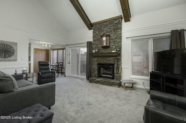 carpeted living room with beamed ceiling, a chandelier, high vaulted ceiling, and a stone fireplace