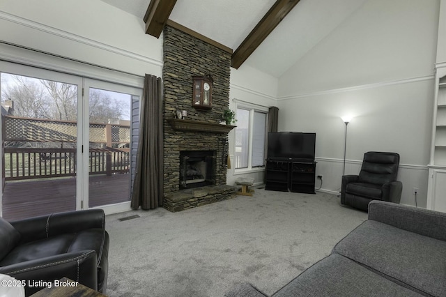 carpeted living room with beam ceiling, a fireplace, and high vaulted ceiling