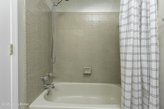 bathroom with shower / bath combination with curtain