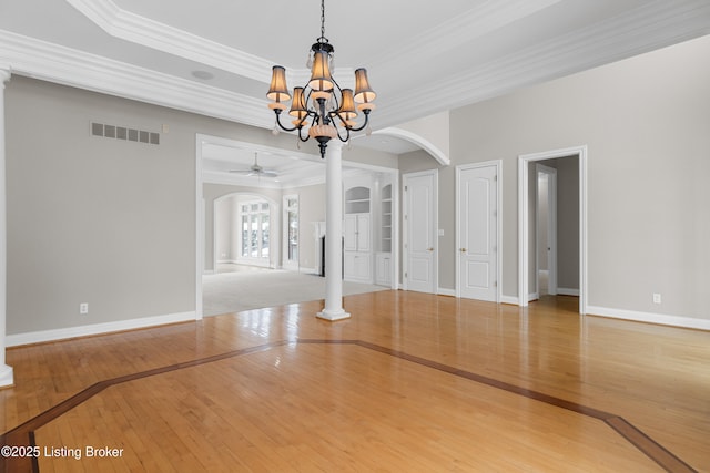 unfurnished room with hardwood / wood-style floors, ceiling fan with notable chandelier, and ornamental molding