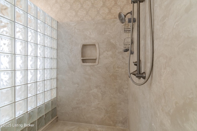 bathroom with tiled shower