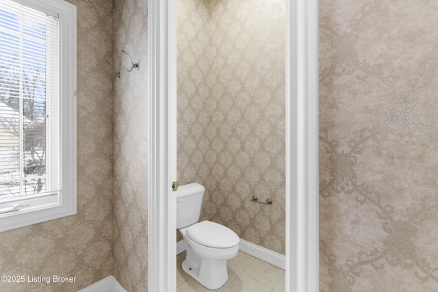 bathroom featuring tile patterned floors and toilet