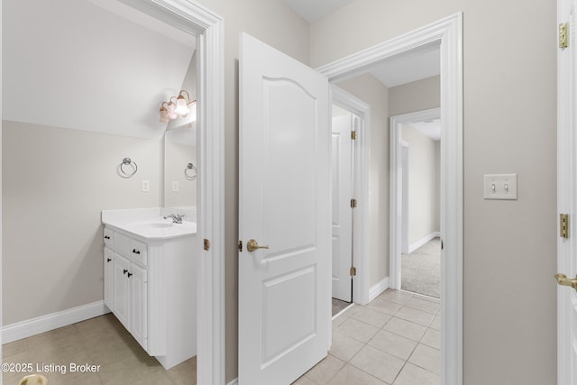 bathroom with tile patterned flooring and vanity