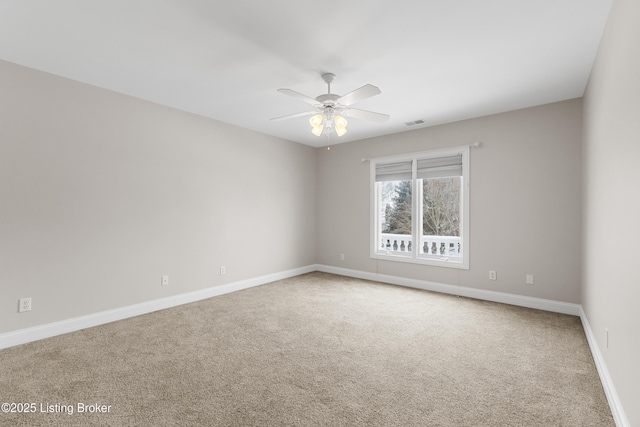 carpeted empty room with ceiling fan