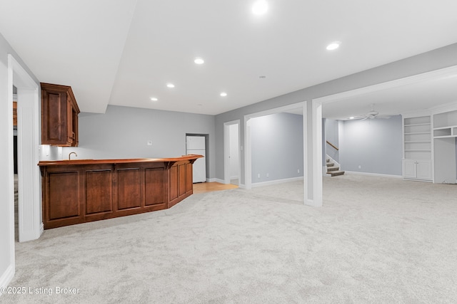 bar featuring built in features and light colored carpet