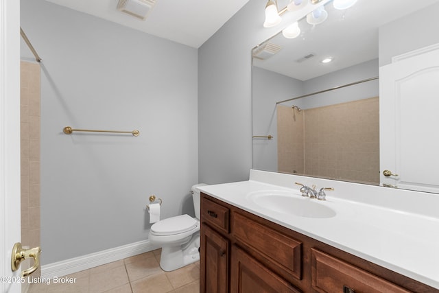 bathroom featuring tile patterned flooring, vanity, and toilet