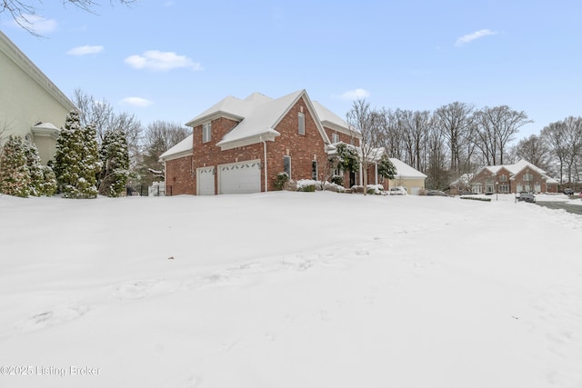 view of snow covered exterior featuring a garage