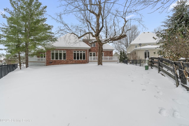 view of snow covered house