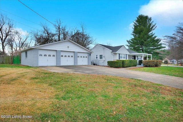 ranch-style home with a front yard and a garage