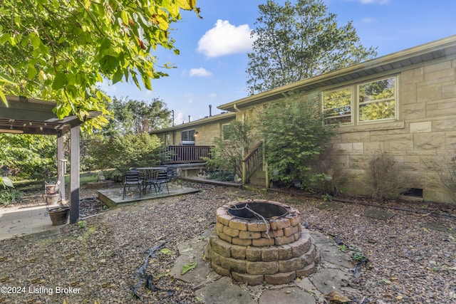 view of yard with a patio area and an outdoor fire pit