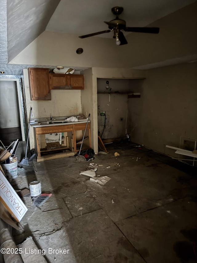 kitchen featuring vaulted ceiling and ceiling fan