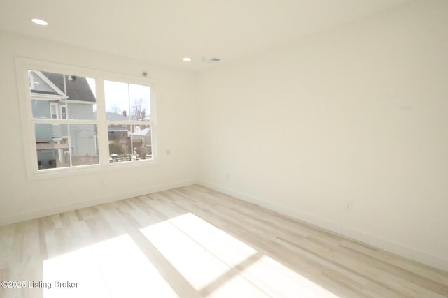 empty room with light wood-type flooring