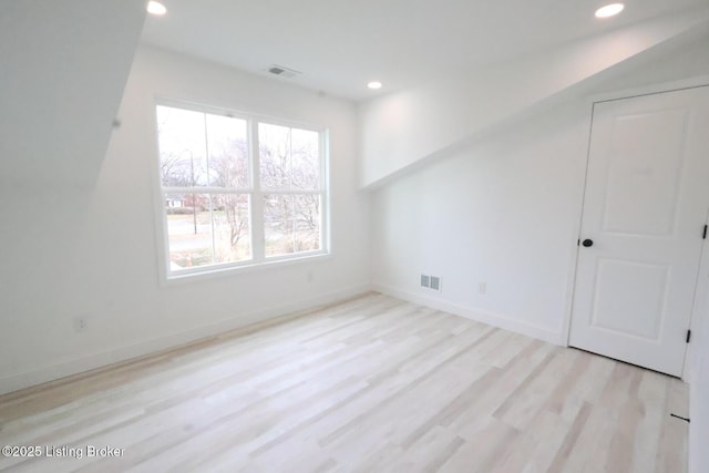 unfurnished room featuring light hardwood / wood-style floors