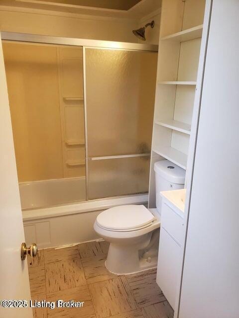 full bathroom with vanity, combined bath / shower with glass door, and toilet