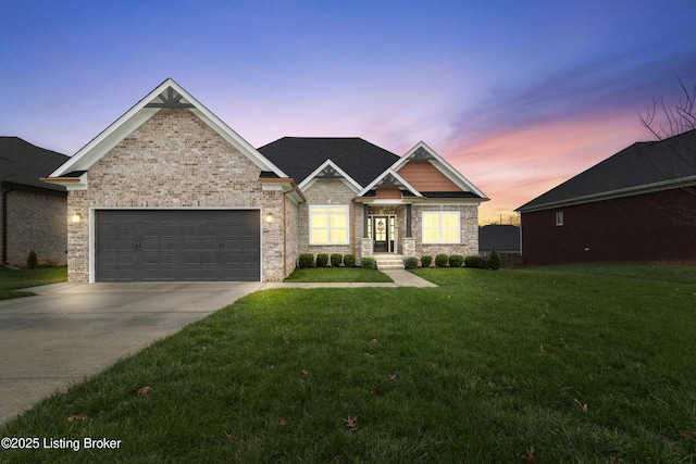 craftsman-style house featuring a lawn and a garage