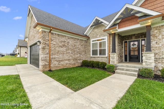 entrance to property featuring a lawn