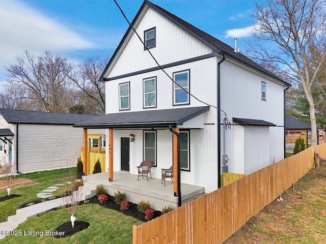 back of house with a porch