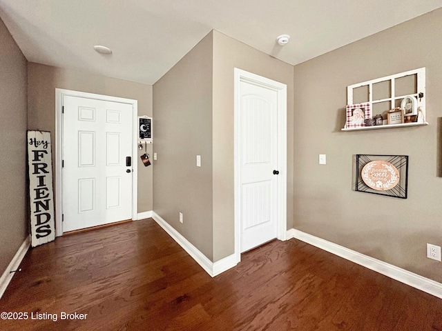 entrance foyer with dark hardwood / wood-style flooring