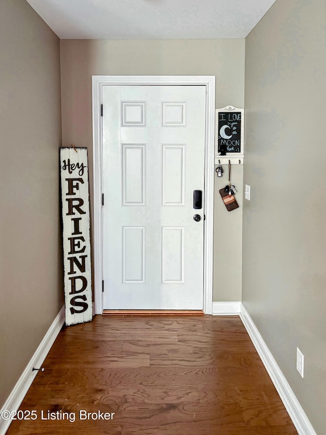 doorway with hardwood / wood-style flooring