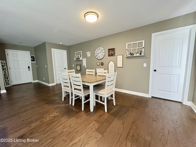 dining space featuring dark hardwood / wood-style flooring