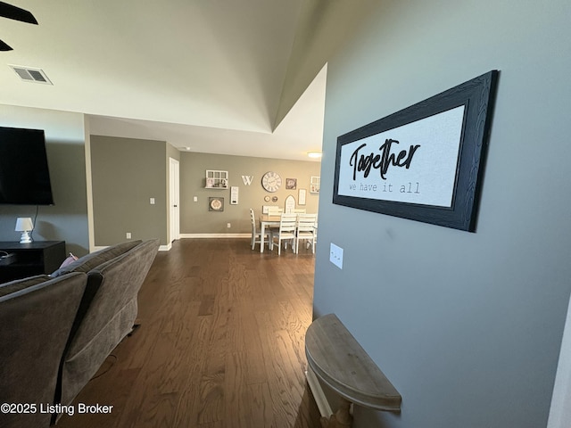 corridor featuring hardwood / wood-style floors