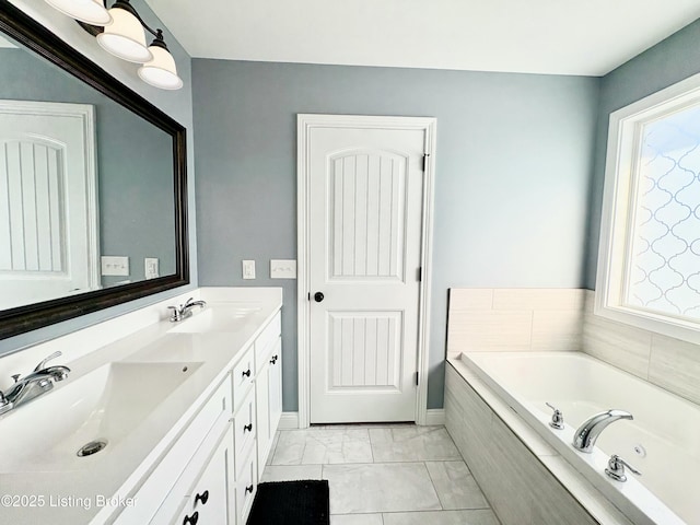 bathroom featuring vanity and a relaxing tiled tub