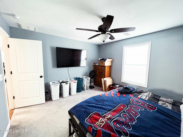 bedroom with carpet, multiple windows, and ceiling fan