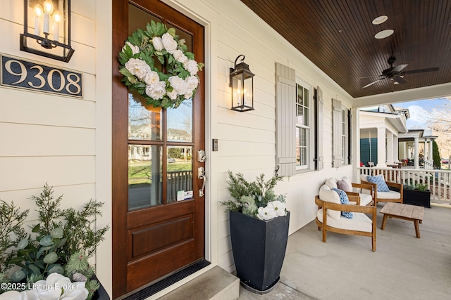 doorway to property featuring ceiling fan