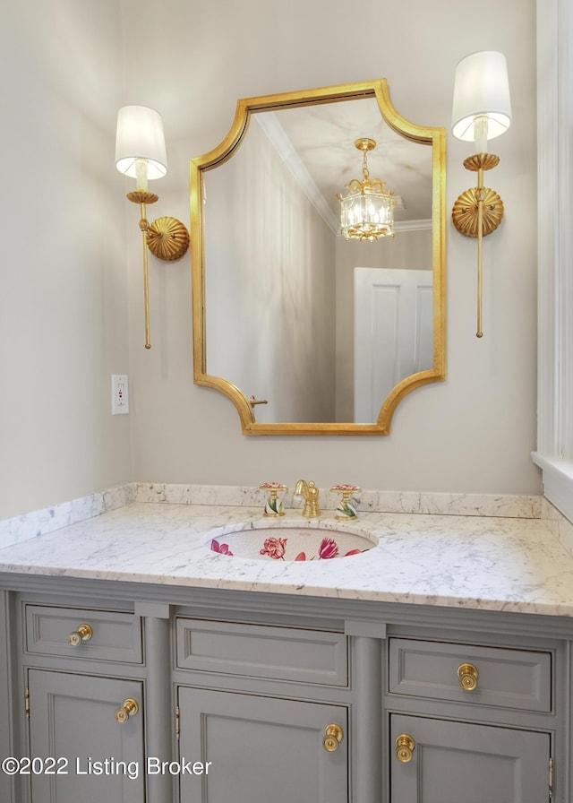 bathroom featuring vanity and crown molding